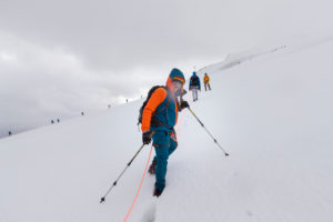 Climber on the way to the Bishorn summit, roped on during a blizzard and heavy fog over the glacier Climber on the way to the Bishorn summit, roped on during a blizzard and heavy fog over the glacier